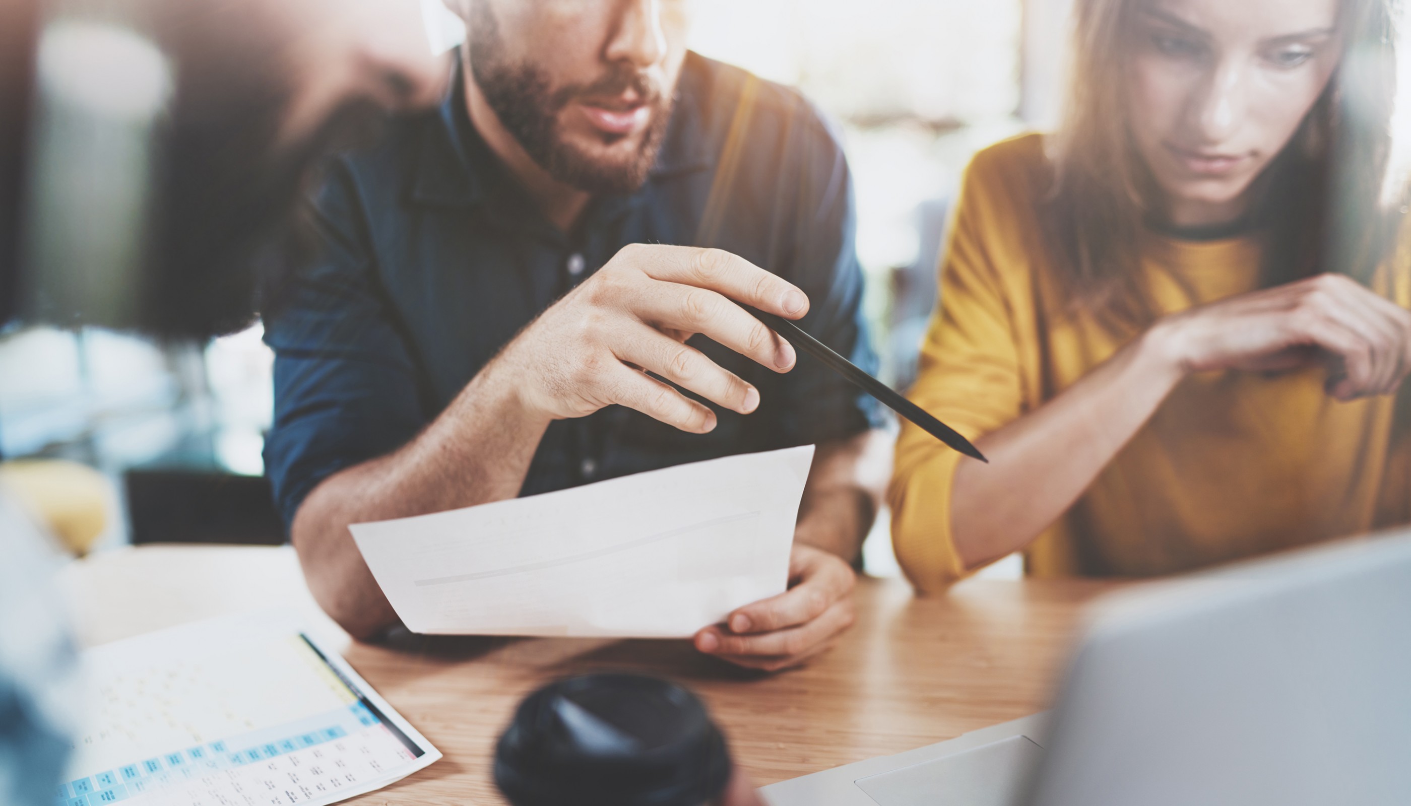 Teamwork concept.Business team sitting at meeting room and making conversations.Horizontal.Blurred background